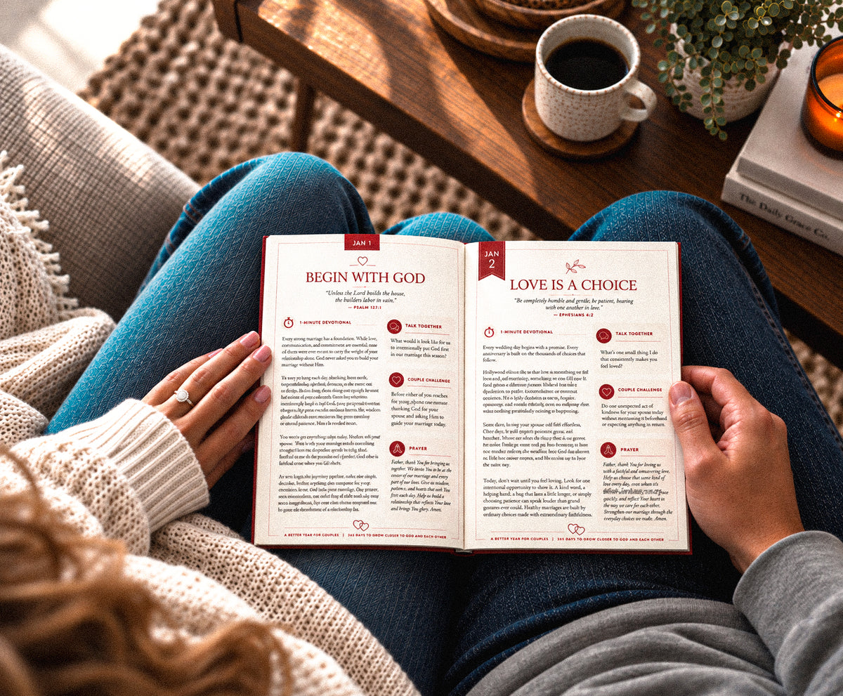 Couple reading a devotional together outdoors